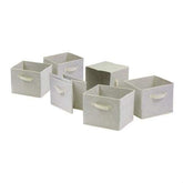 Four white storage boxes with handles, stacked together for organization.